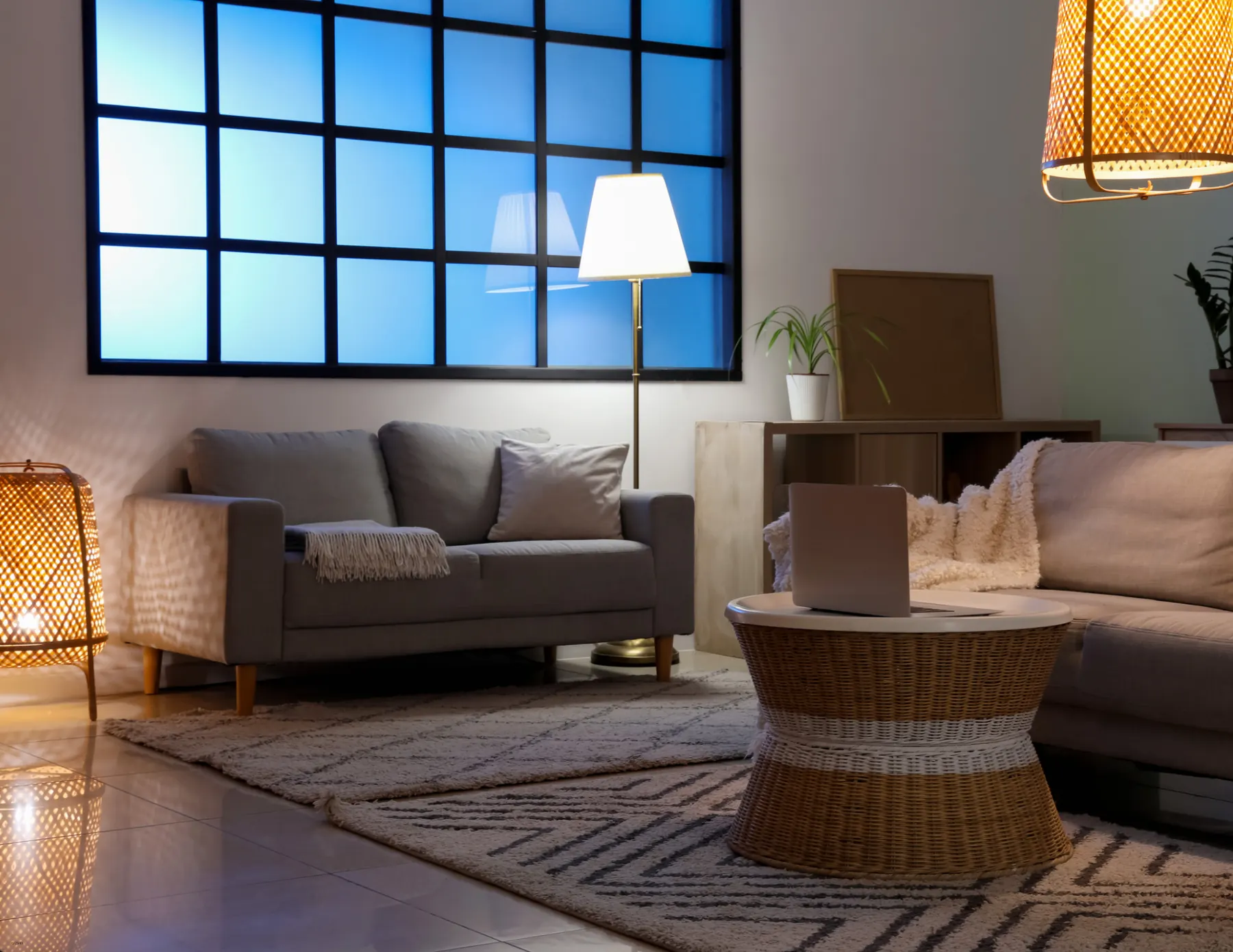 Furnished loft living room with large industrial windows, the kind of space a 3D walkthrough lets you tour online